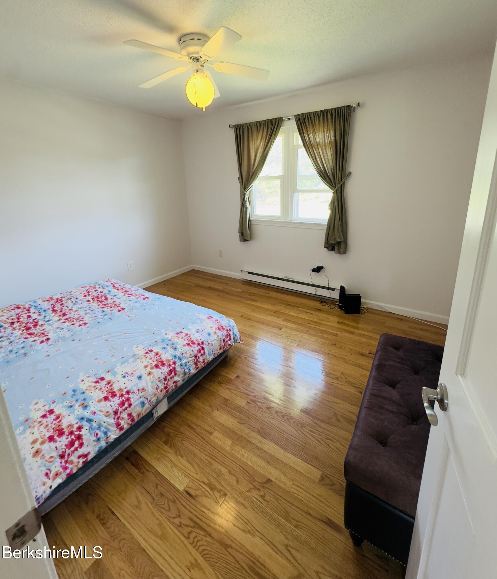 127 Oak Hill Road Pittsfield, MA 01201 - Photo 17 of 22 a bedroom with a bed dresser and a window