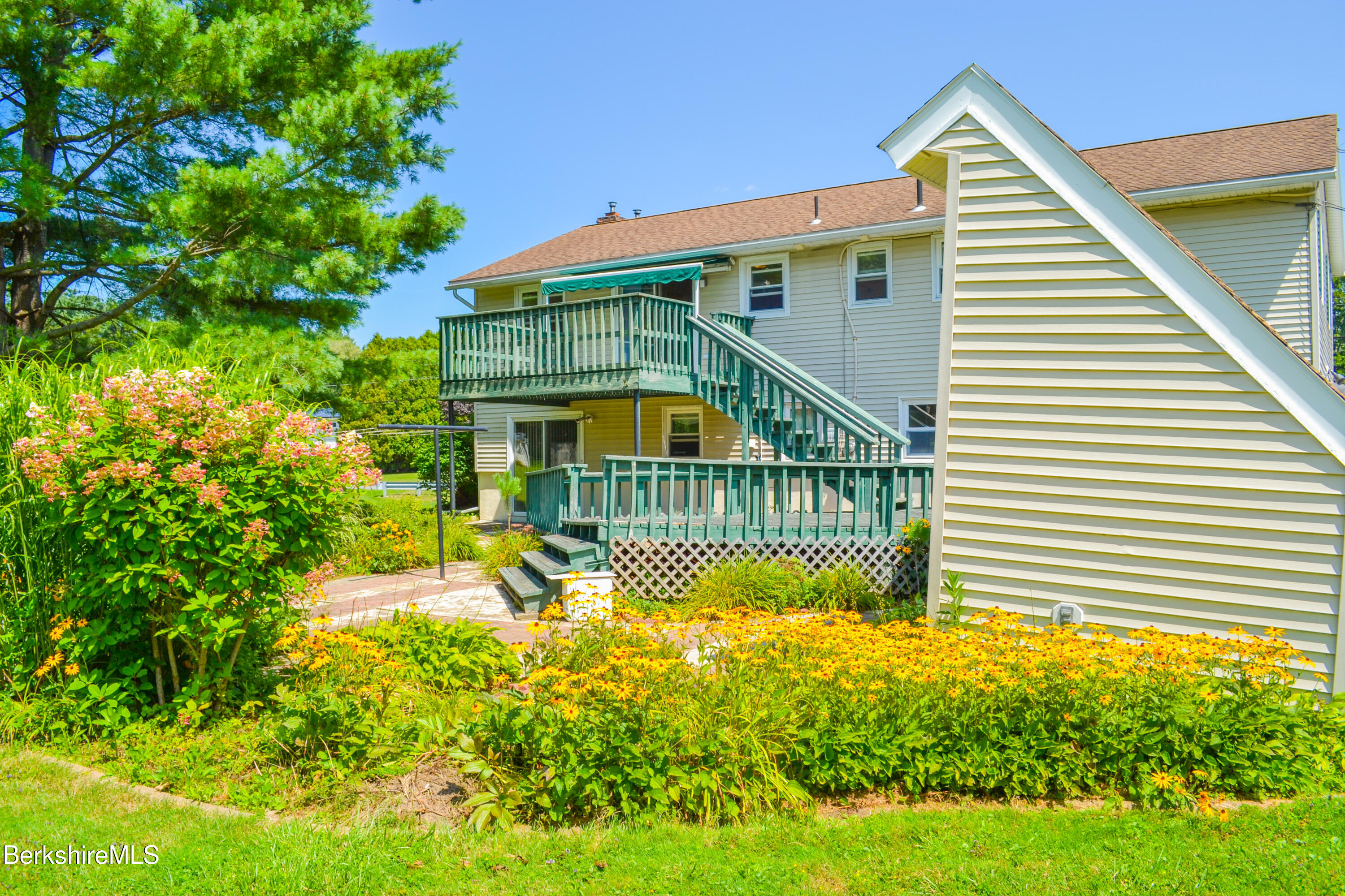 127 Oak Hill Road Pittsfield, MA 01201 - Photo 3 of 22 a front view of a house with a garden