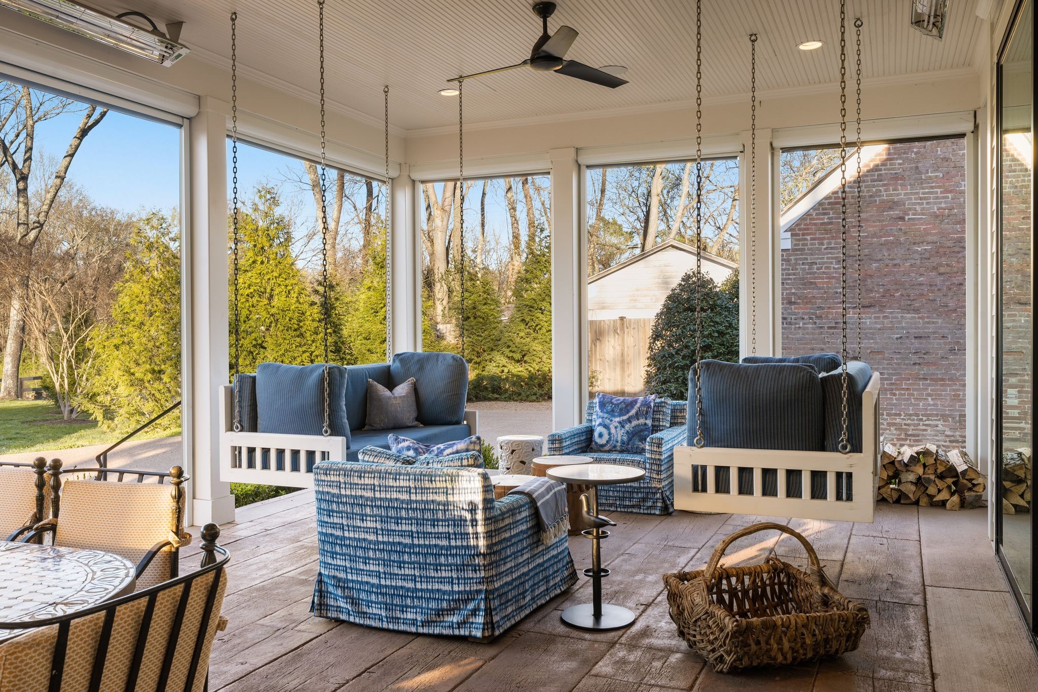 501 Murfreesboro Road Franklin, TN 37064 - Photo 77 of 83 a living room with furniture a flat screen tv and a floor to ceiling window