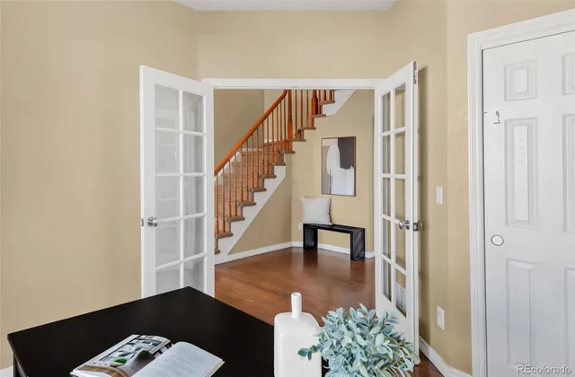 a bedroom with a bed couch and window