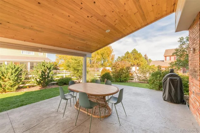 a view of a backyard with a tree