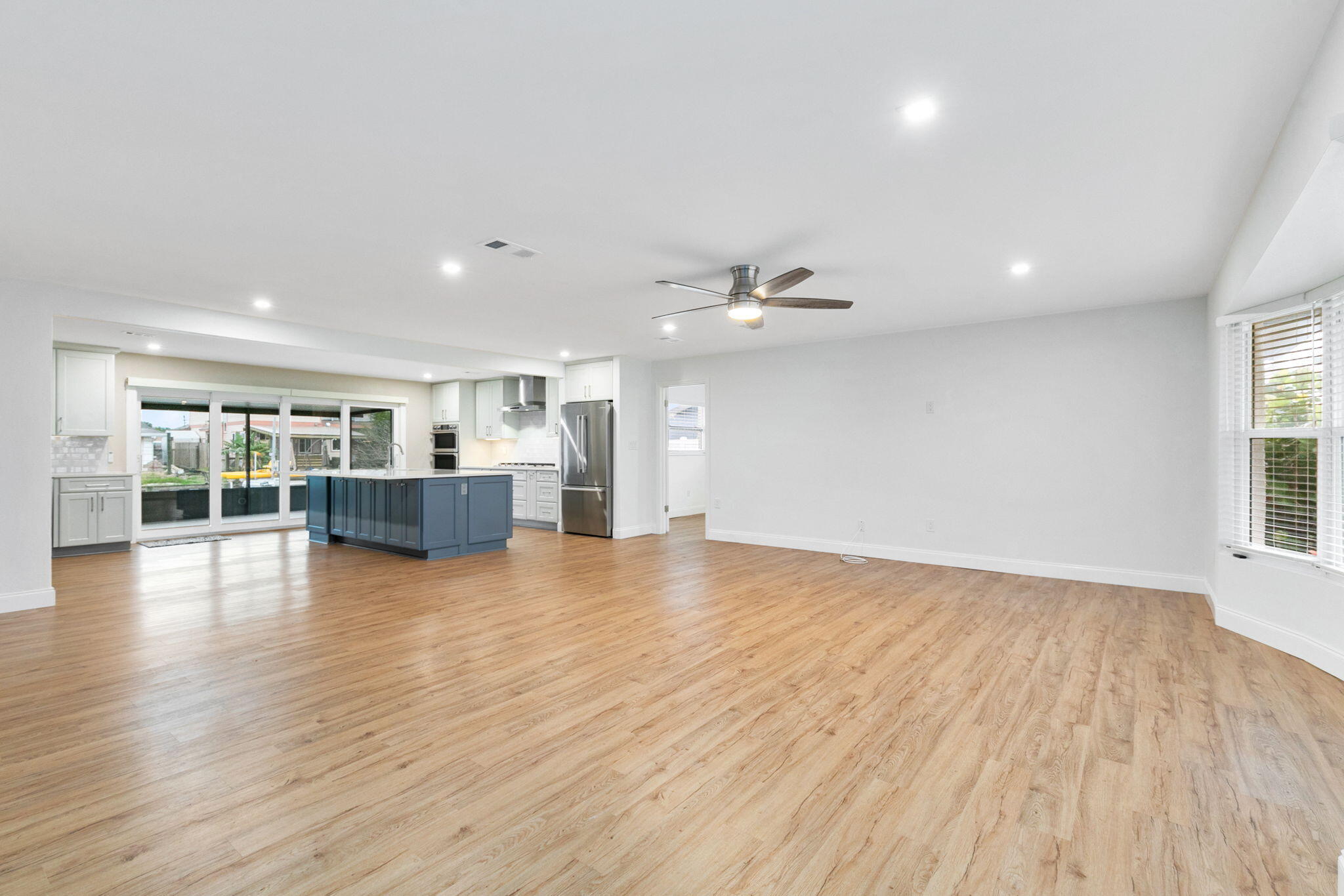 1700 Rochelle Parkway Merritt Island, FL 32952 - Photo 11 of 35 a view of empty room with wooden floor and windows