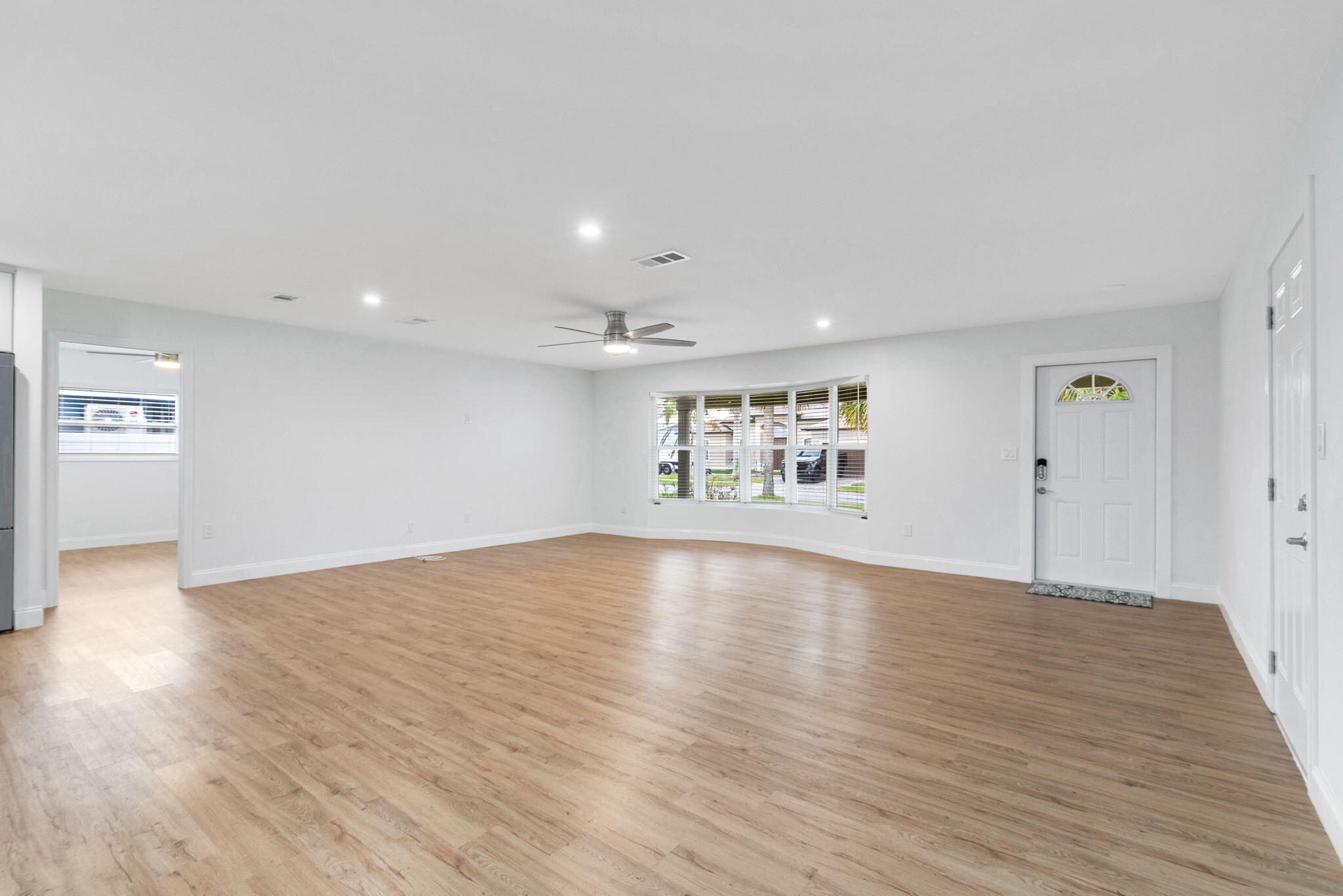 1700 Rochelle Parkway Merritt Island, FL 32952 - Photo 14 of 35 a view of empty room with wooden floor and fan