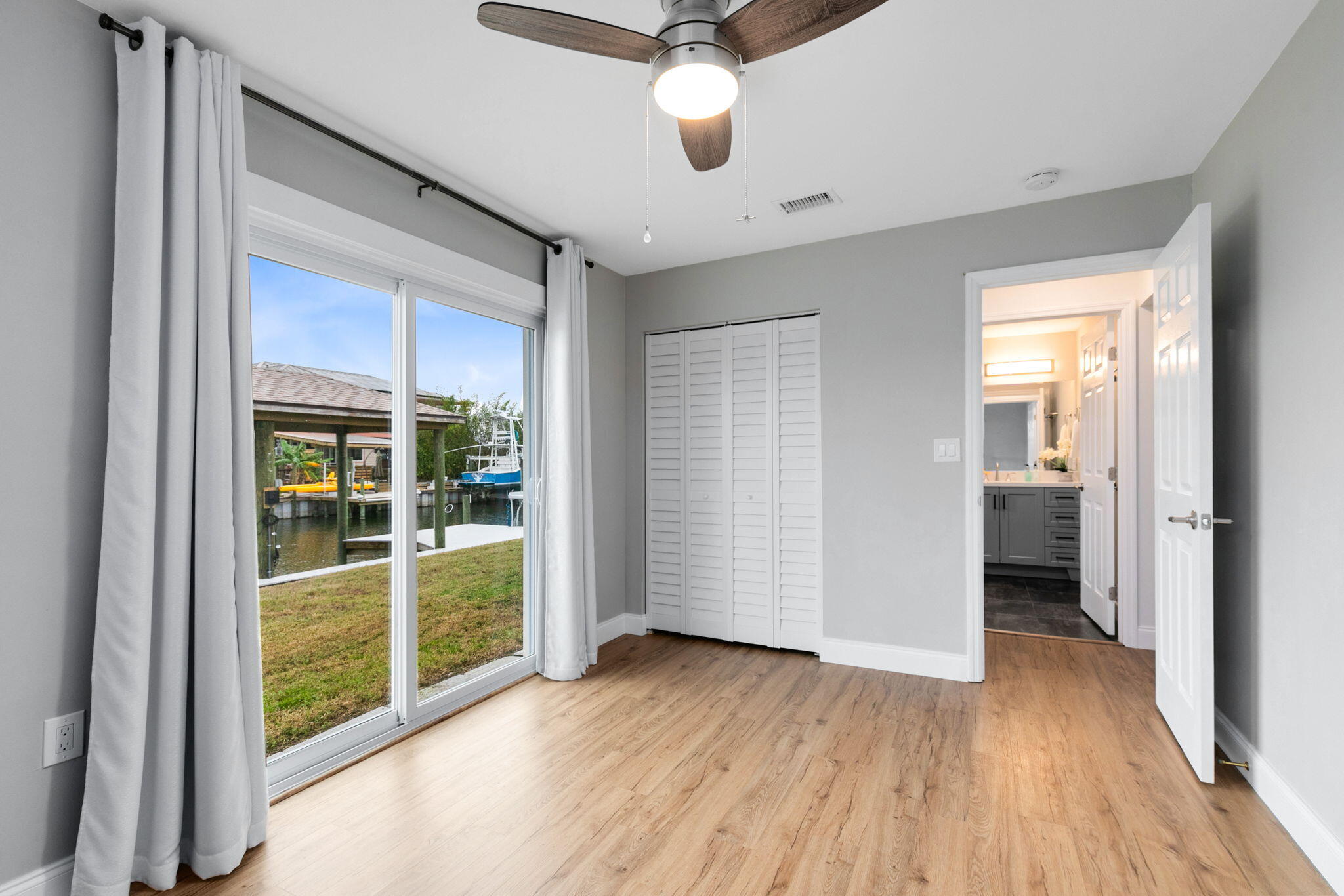 1700 Rochelle Parkway Merritt Island, FL 32952 - Photo 19 of 35 wooden floor in an empty room with a window
