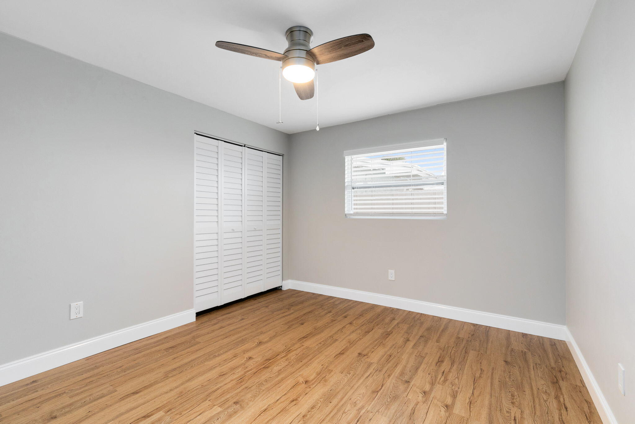 1700 Rochelle Parkway Merritt Island, FL 32952 - Photo 23 of 35 an empty room with wooden floor and windows