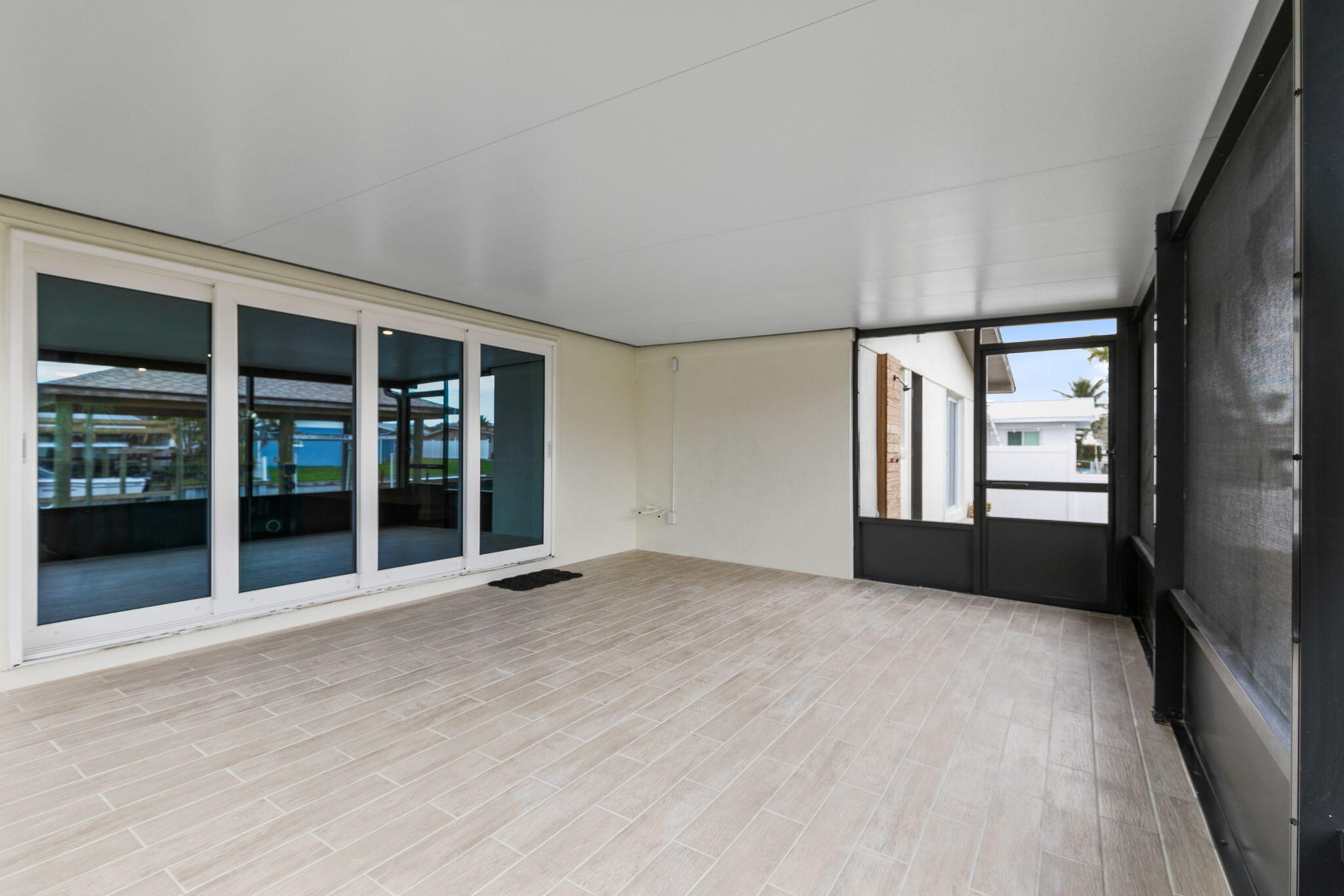 1700 Rochelle Parkway Merritt Island, FL 32952 - Photo 24 of 35 a view of an empty room with a window and wooden floor