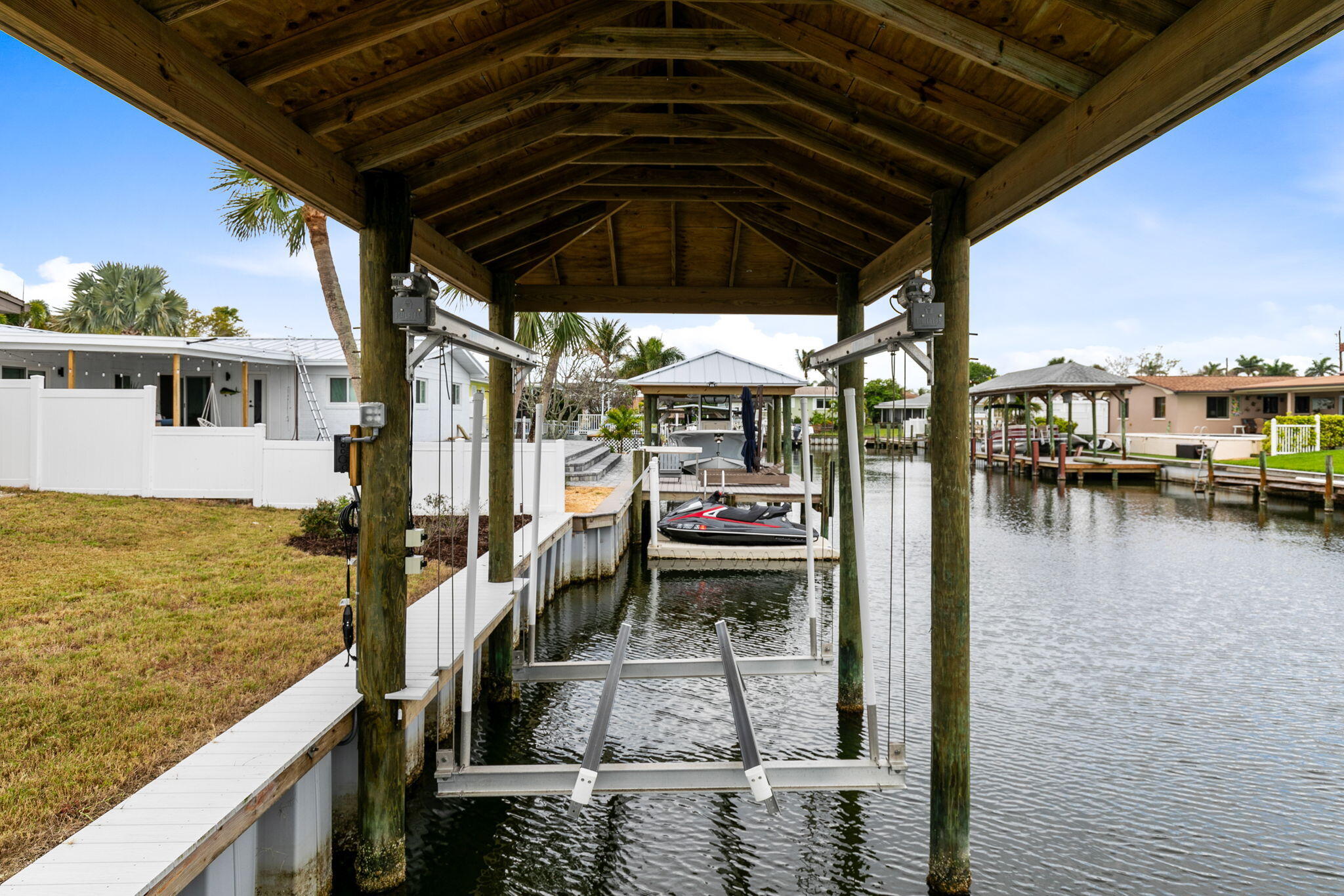 1700 Rochelle Parkway Merritt Island, FL 32952 - Photo 28 of 35 a view of a balcony with chair and wooden floor