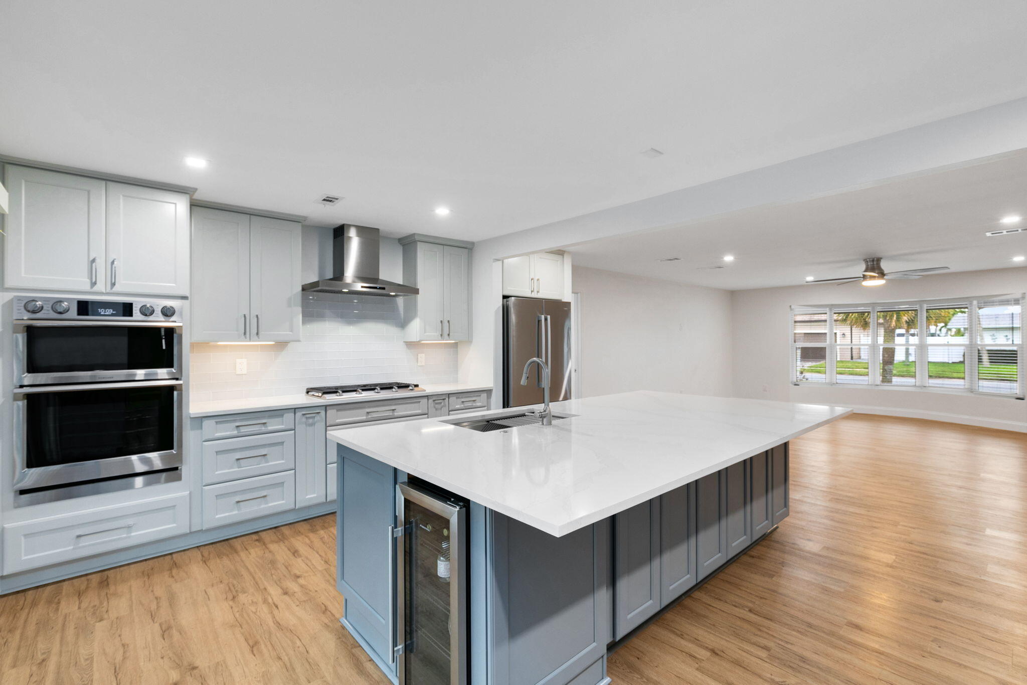 1700 Rochelle Parkway Merritt Island, FL 32952 - Photo 5 of 35 a kitchen with stainless steel appliances granite countertop a kitchen island a stove and a sink