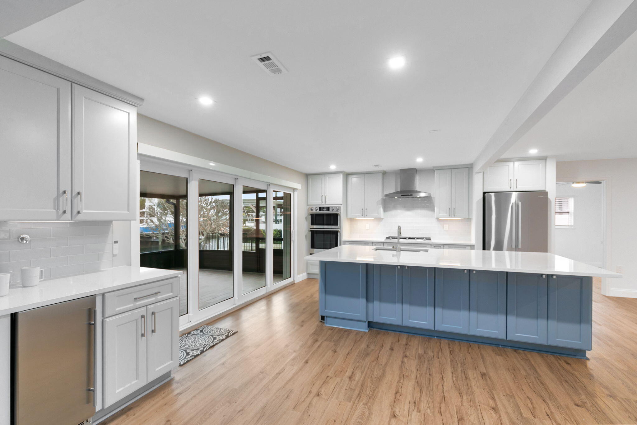 1700 Rochelle Parkway Merritt Island, FL 32952 - Photo 6 of 35 a kitchen with stainless steel appliances granite countertop a sink a stove and a wooden floors