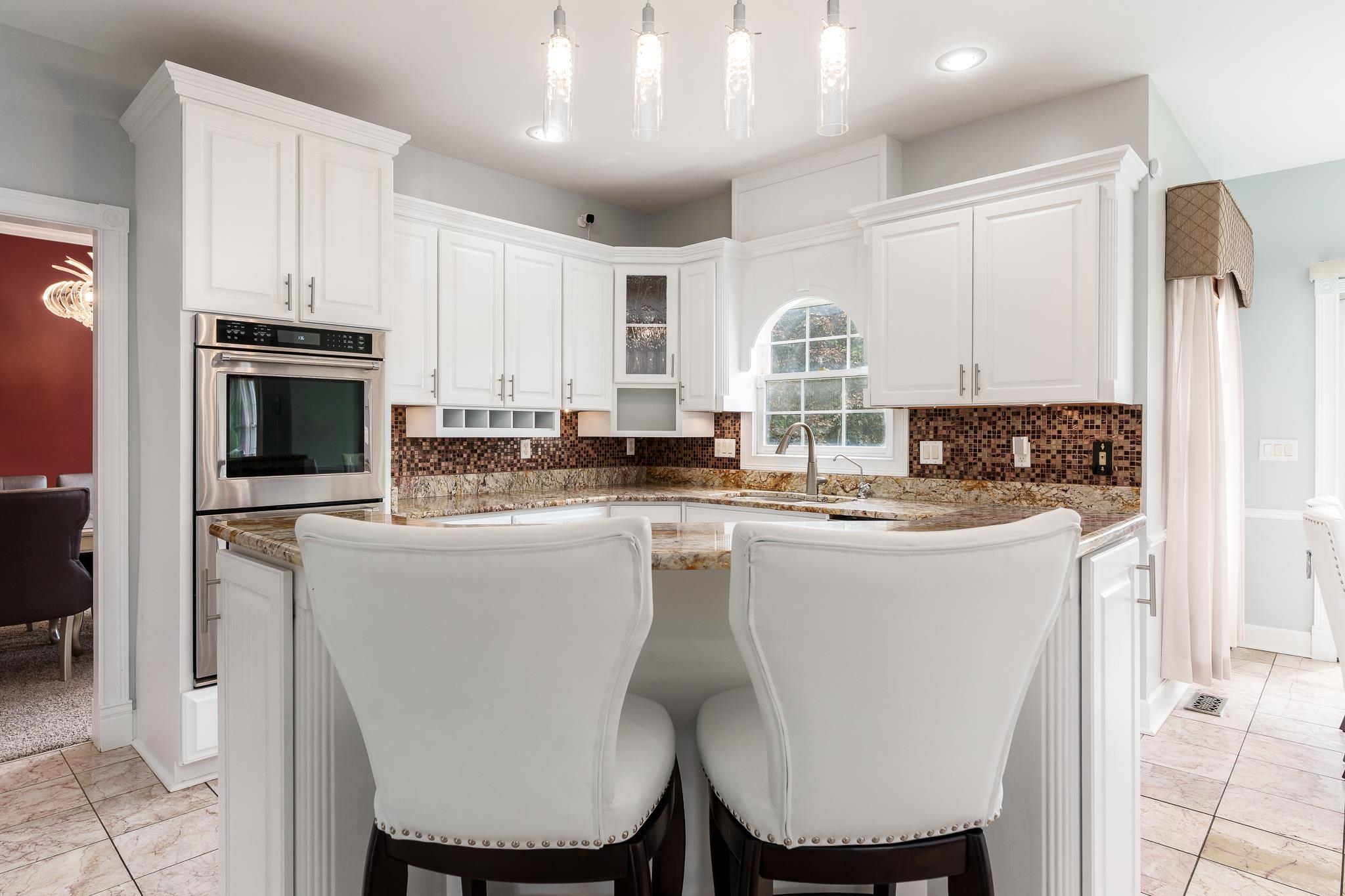 9311 Ridgeview Road Belvidere, IL 61008 - Photo 23 of 89 a kitchen with stainless steel appliances granite countertop a stove a sink a microwave a refrigerator and white cabinets