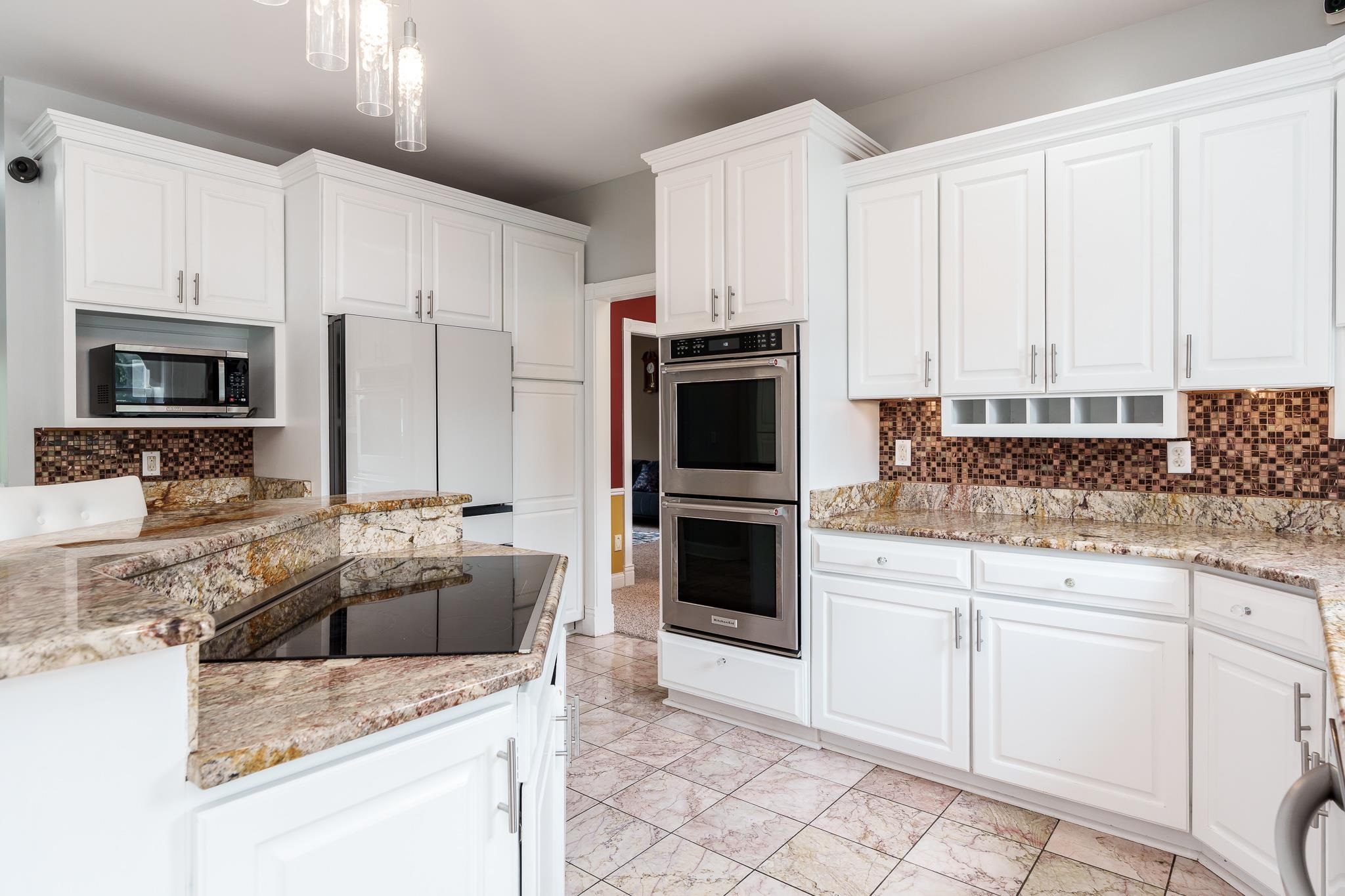 9311 Ridgeview Road Belvidere, IL 61008 - Photo 25 of 89 a kitchen with granite countertop a sink a counter top space appliances and cabinets
