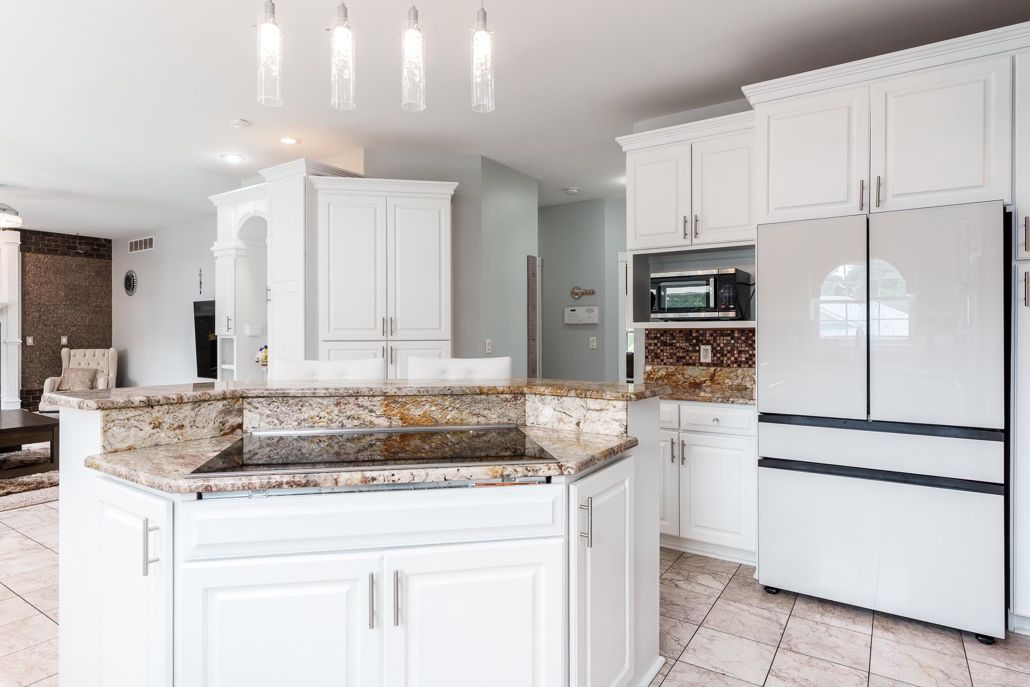 9311 Ridgeview Road Belvidere, IL 61008 - Photo 27 of 89 a kitchen with kitchen island granite countertop a stove a sink and a refrigerator