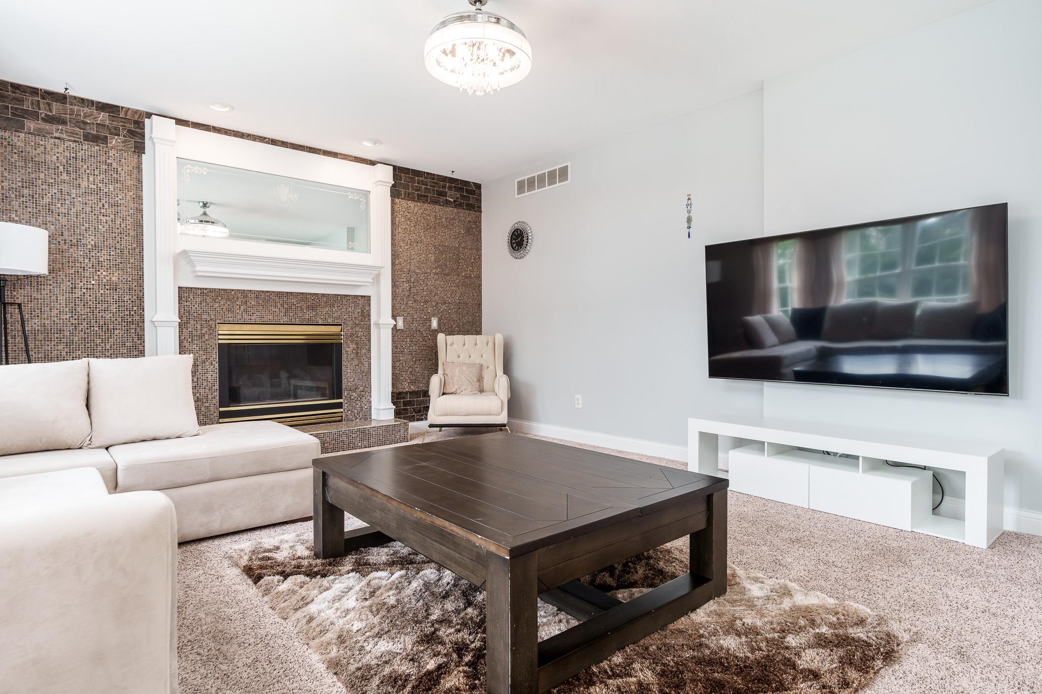 9311 Ridgeview Road Belvidere, IL 61008 - Photo 29 of 89 a living room with a flat screen tv and a fireplace