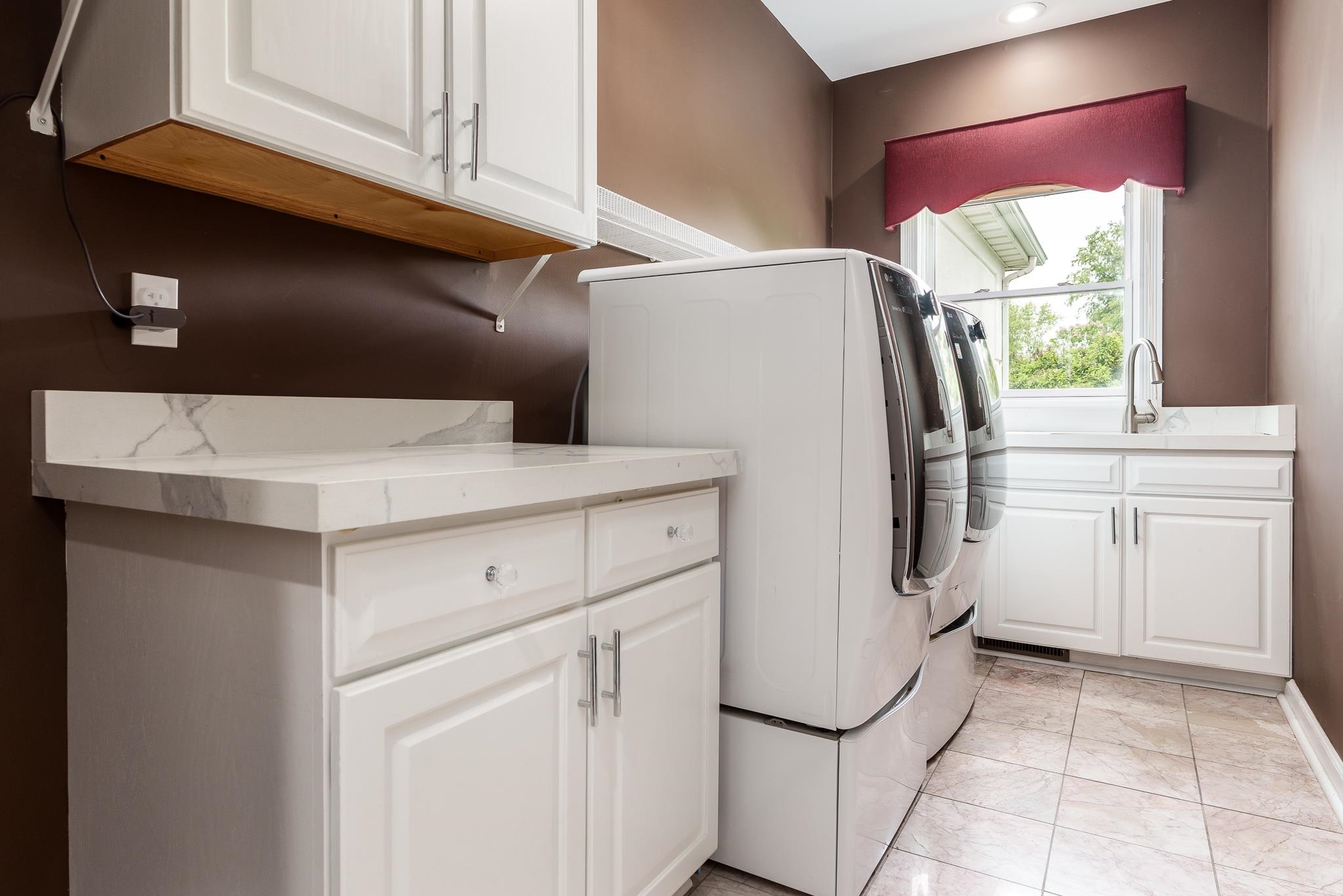 9311 Ridgeview Road Belvidere, IL 61008 - Photo 35 of 89 a kitchen with a refrigerator sink and cabinets