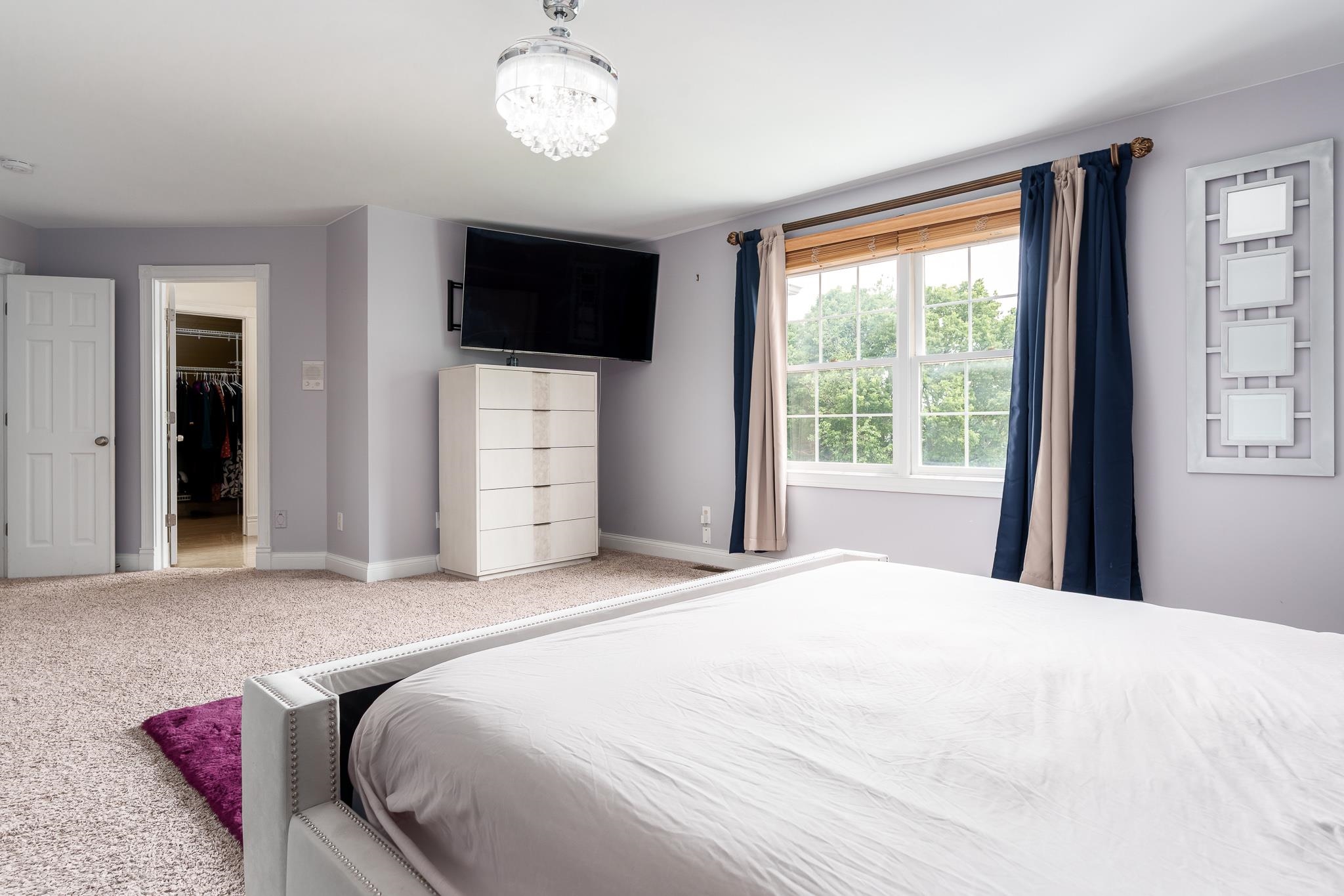 9311 Ridgeview Road Belvidere, IL 61008 - Photo 38 of 89 a bedroom with a large bed and a flat tv screen on dresser