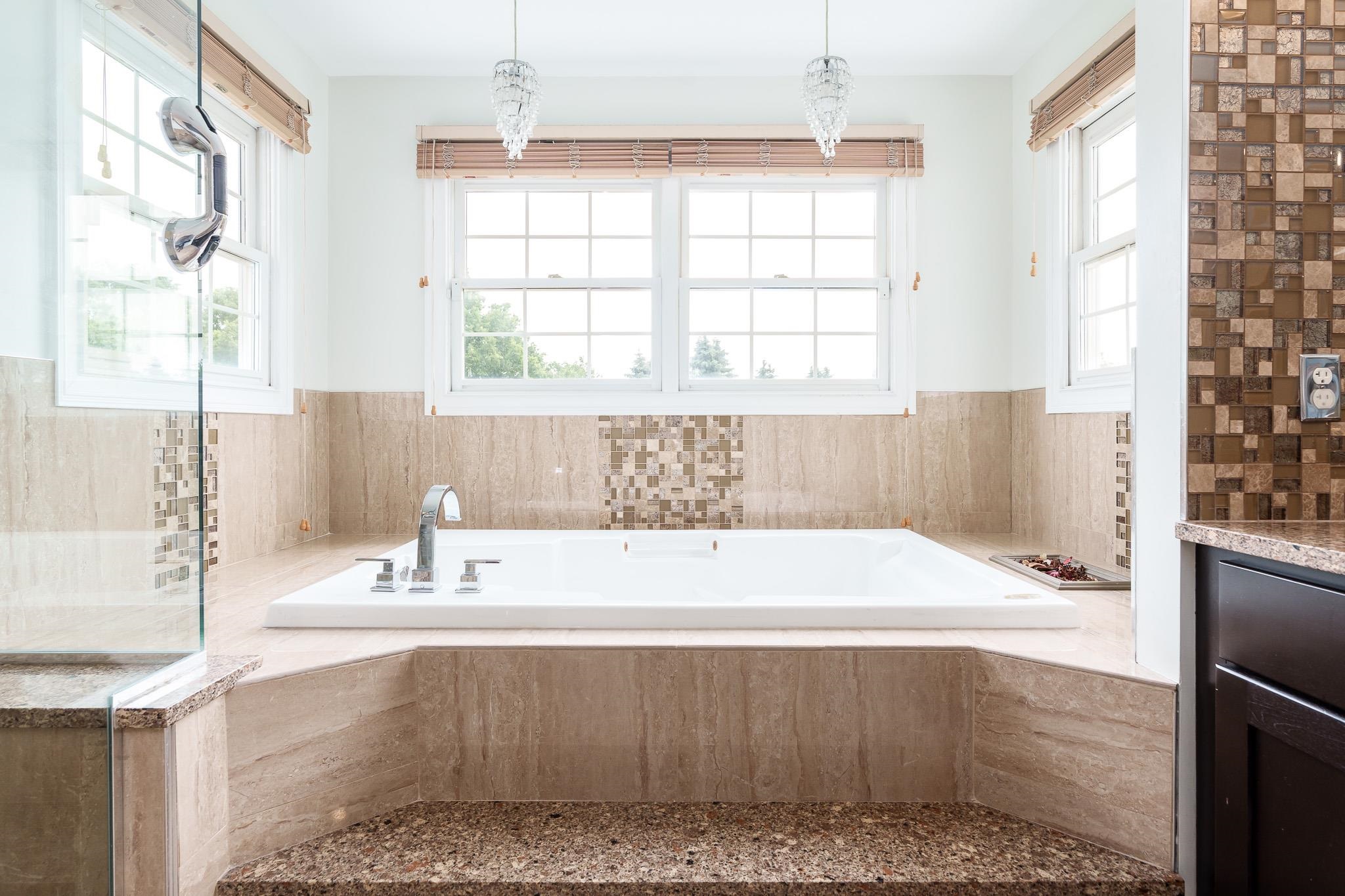 9311 Ridgeview Road Belvidere, IL 61008 - Photo 40 of 89 a bathroom with a bathtub and window