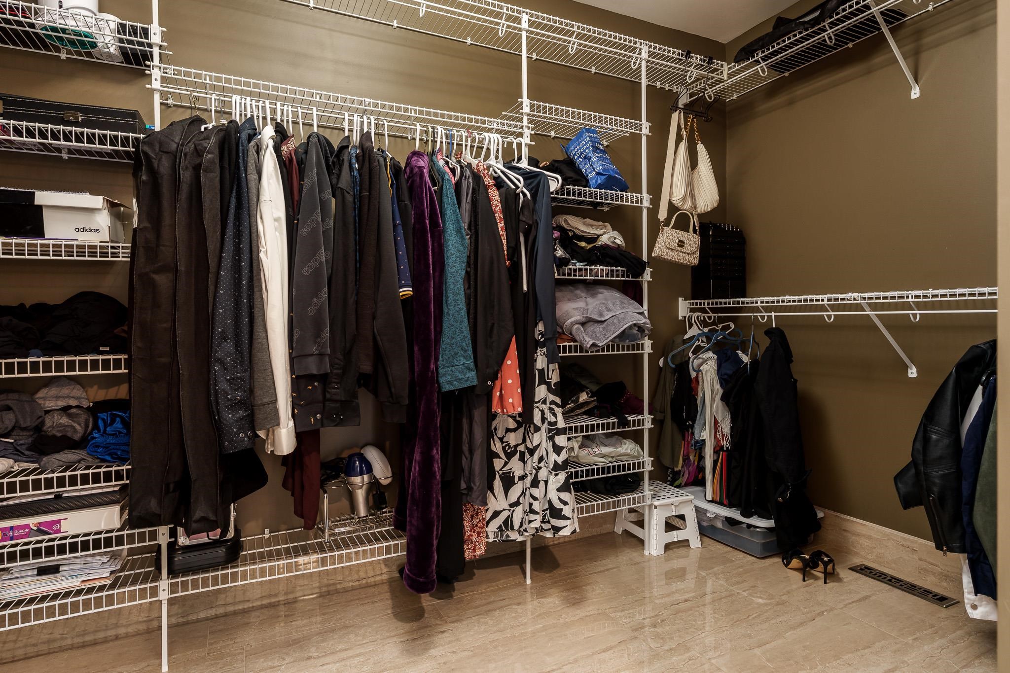 9311 Ridgeview Road Belvidere, IL 61008 - Photo 42 of 89 a view of walk in closet with clothes and shoes