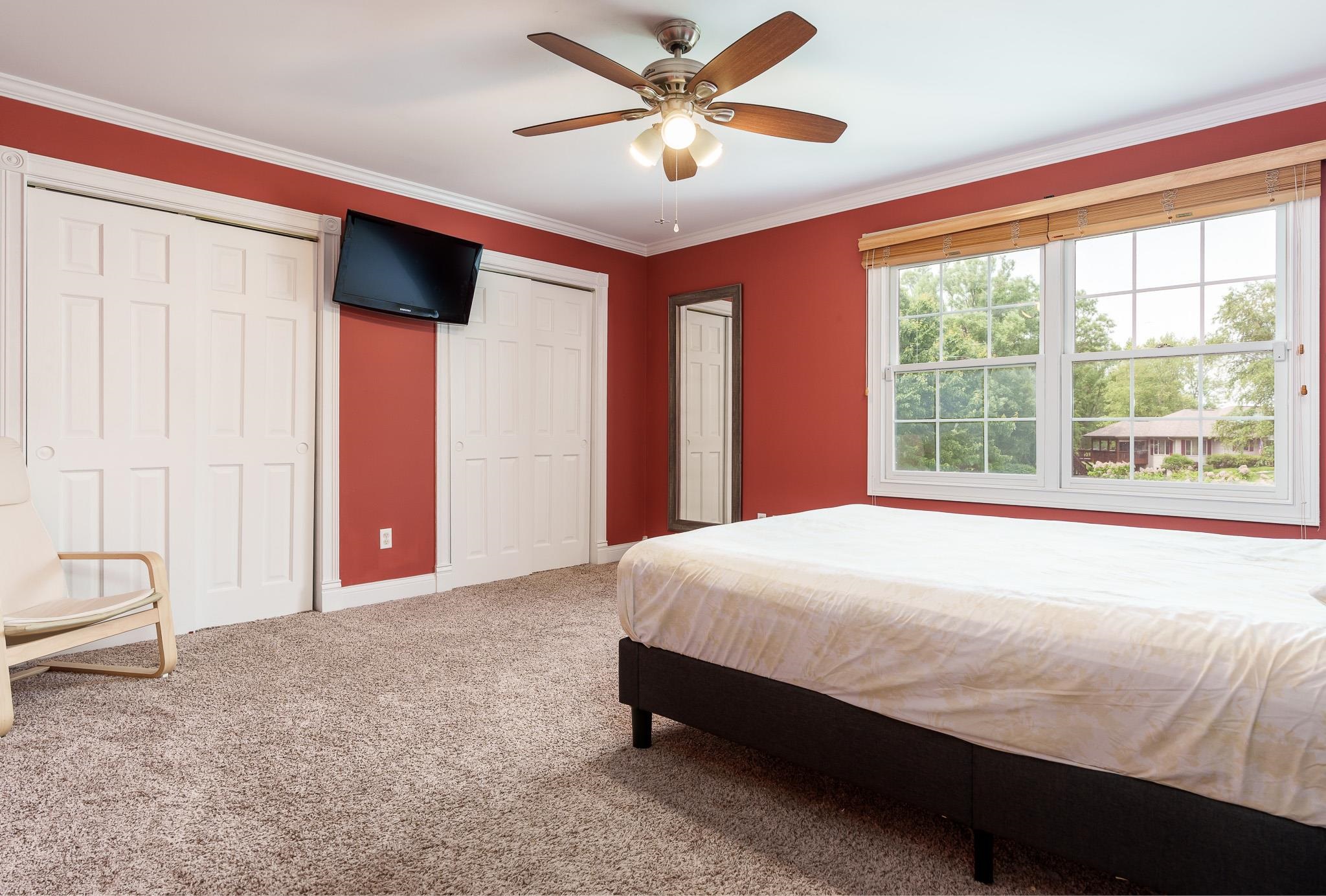 9311 Ridgeview Road Belvidere, IL 61008 - Photo 43 of 89 a bedroom with a large bed and a large window