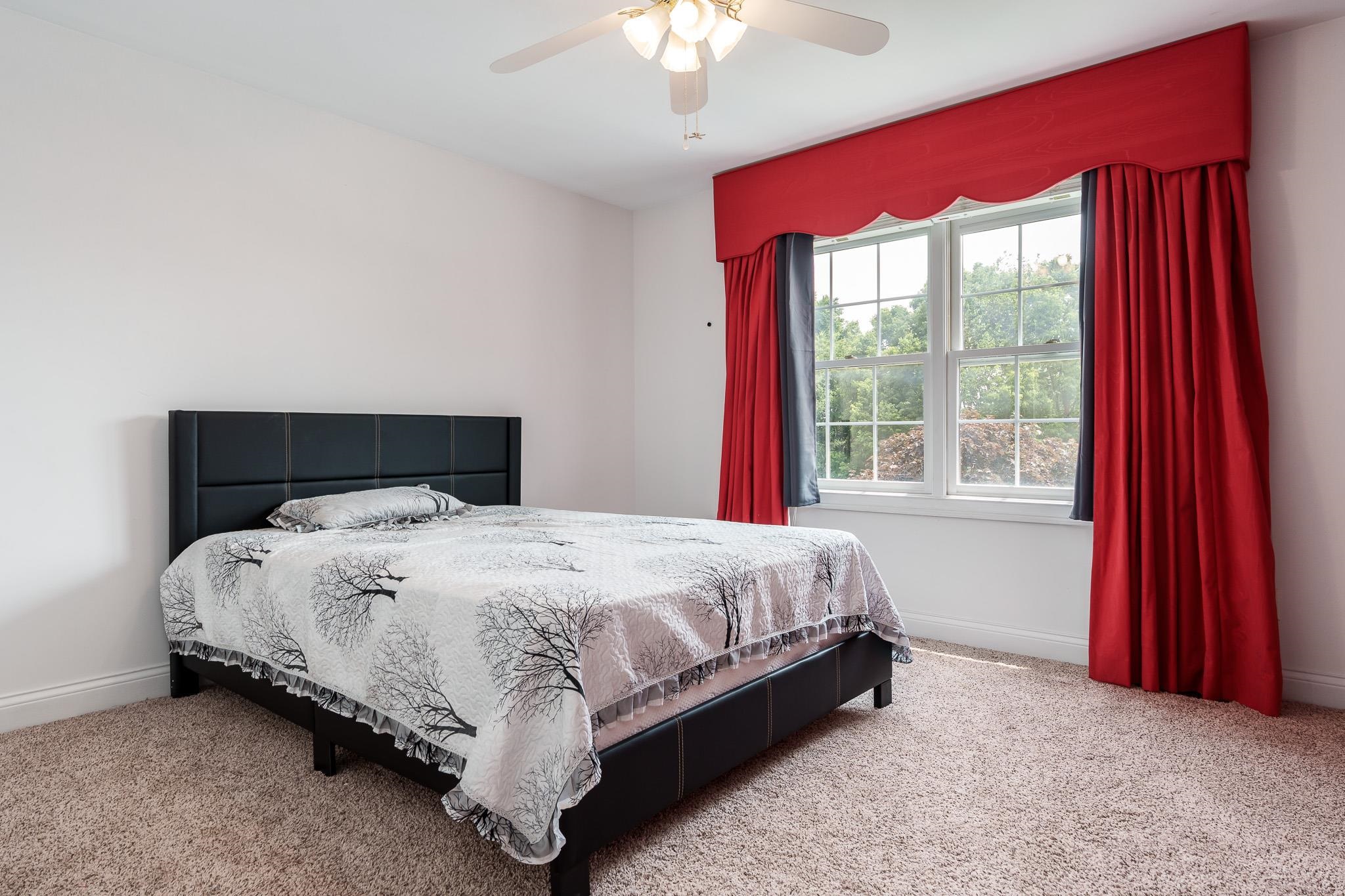 9311 Ridgeview Road Belvidere, IL 61008 - Photo 45 of 89 a bedroom with a bed and window