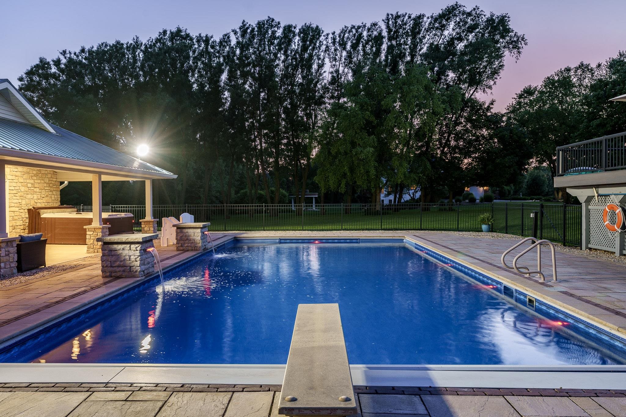 9311 Ridgeview Road Belvidere, IL 61008 - Photo 5 of 89 a view of swimming pool with seating space and trees in the background