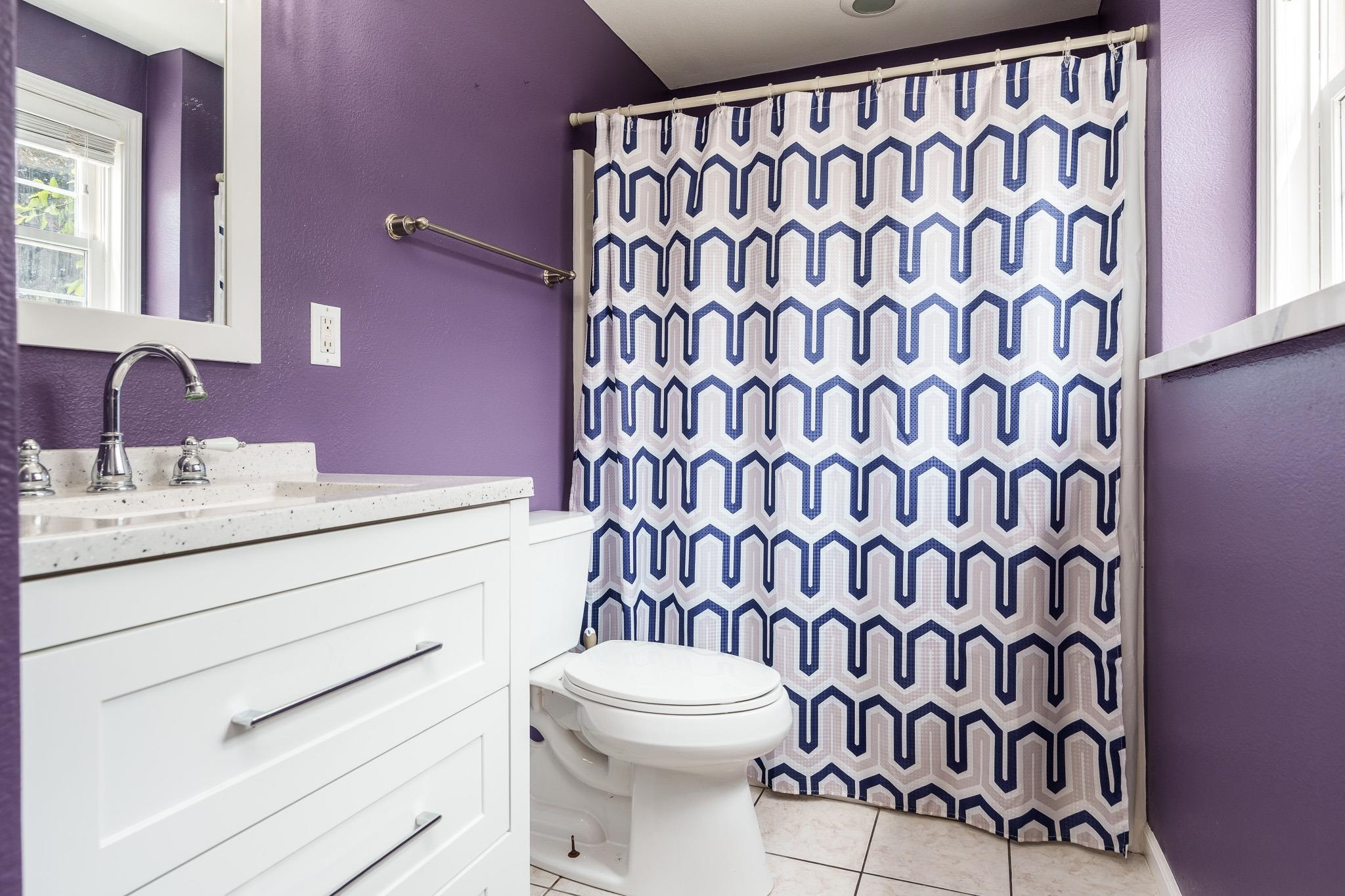 9311 Ridgeview Road Belvidere, IL 61008 - Photo 53 of 89 a bathroom with a sink a toilet and a shower curtain