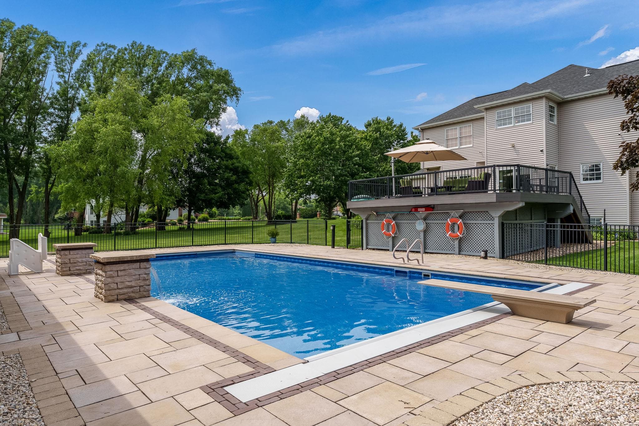 9311 Ridgeview Road Belvidere, IL 61008 - Photo 59 of 89 a view of swimming pool with seating space and trees in the background