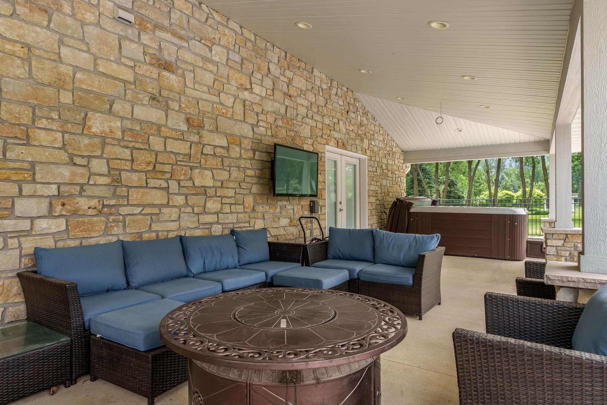 9311 Ridgeview Road Belvidere, IL 61008 - Photo 64 of 89 a living room with furniture and a flat screen tv