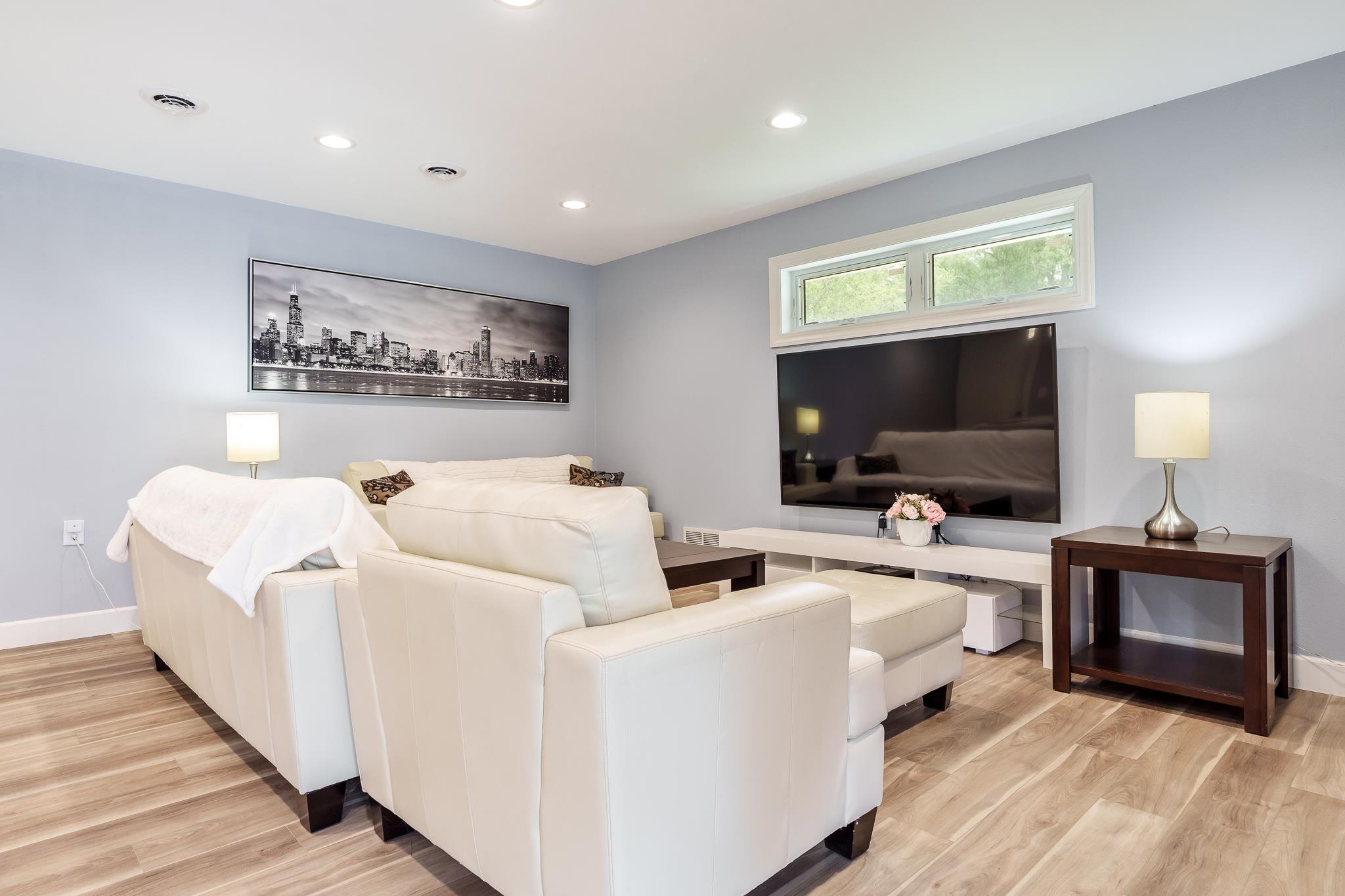 9311 Ridgeview Road Belvidere, IL 61008 - Photo 69 of 89 a living room with furniture and a flat screen tv