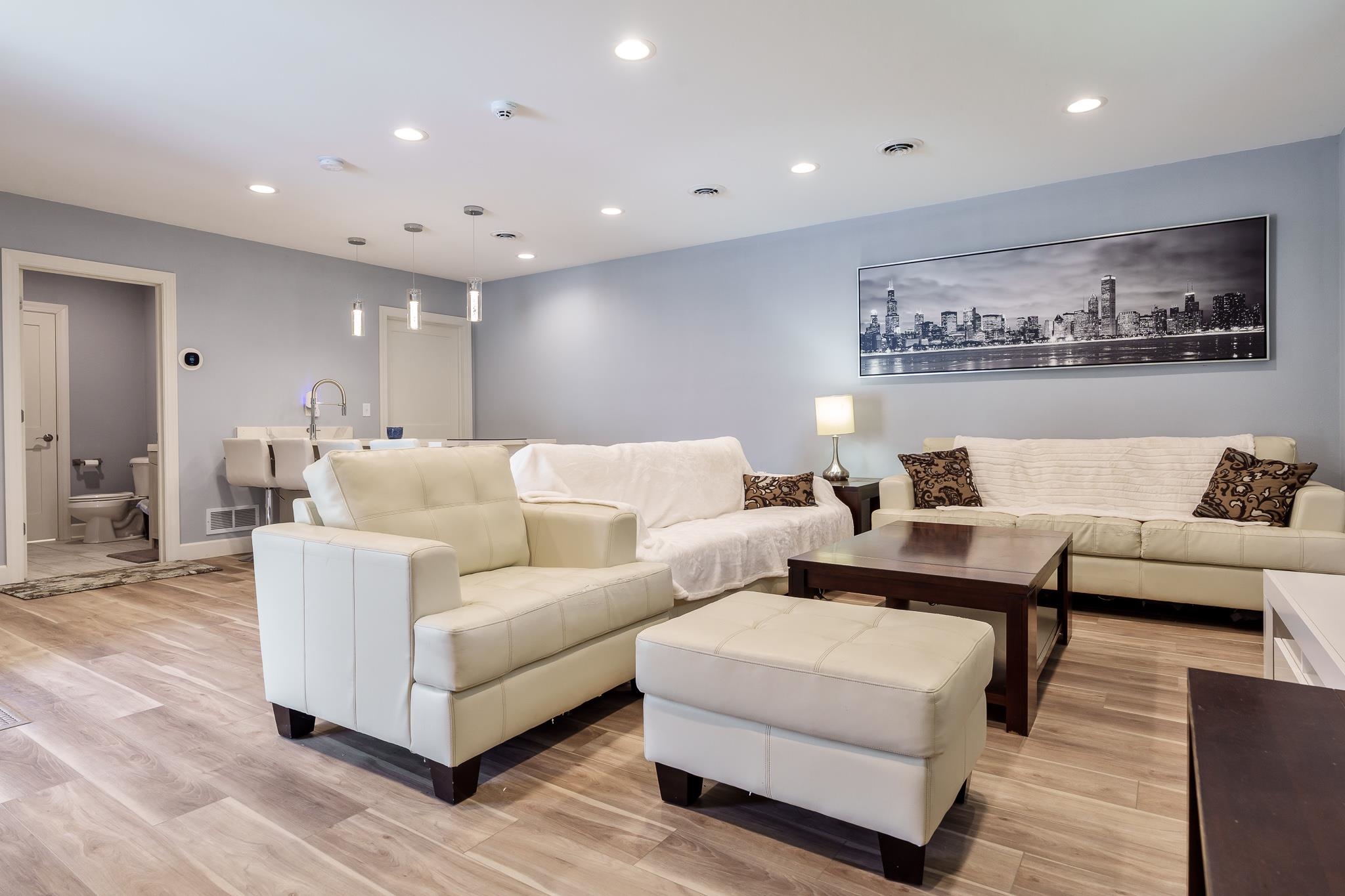 9311 Ridgeview Road Belvidere, IL 61008 - Photo 70 of 89 a living room with furniture and a large mirror