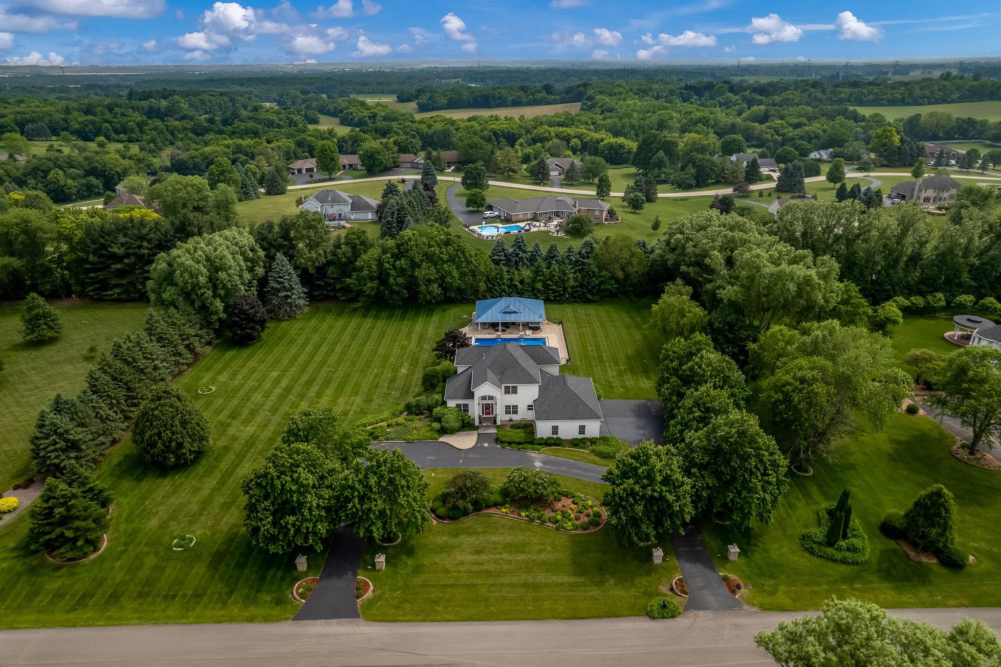 9311 Ridgeview Road Belvidere, IL 61008 - Photo 80 of 89 an aerial view of a house with a yard and lake view