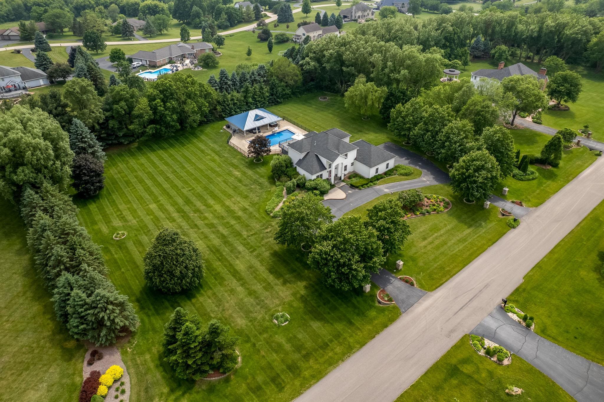 9311 Ridgeview Road Belvidere, IL 61008 - Photo 81 of 89 an aerial view of a house with a yard