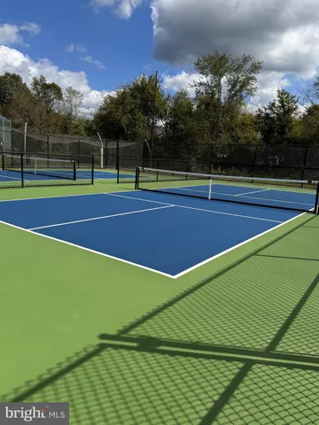 a view of an outdoor space and tennis court