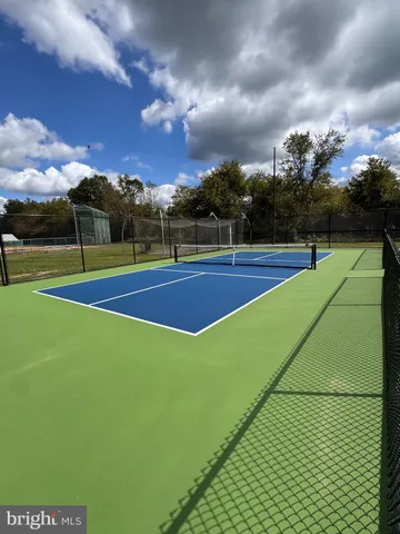 a view of an outdoor space and tennis court