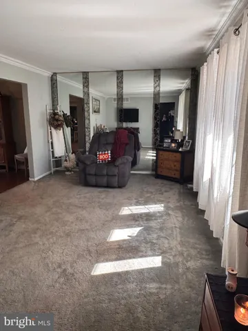 a room with furniture and a flat screen tv