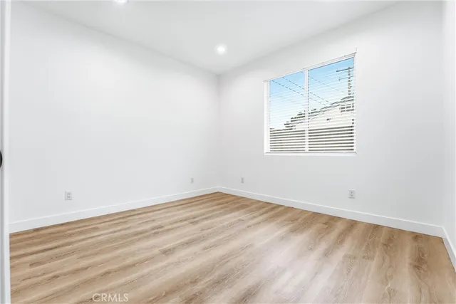 a bathroom with double sink and a mirror