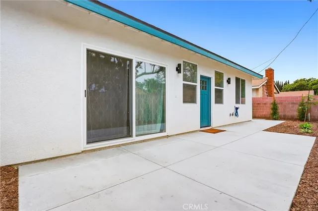 a backyard of a house with seating space