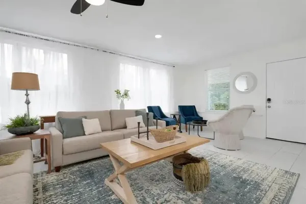 a living room with furniture and a large window