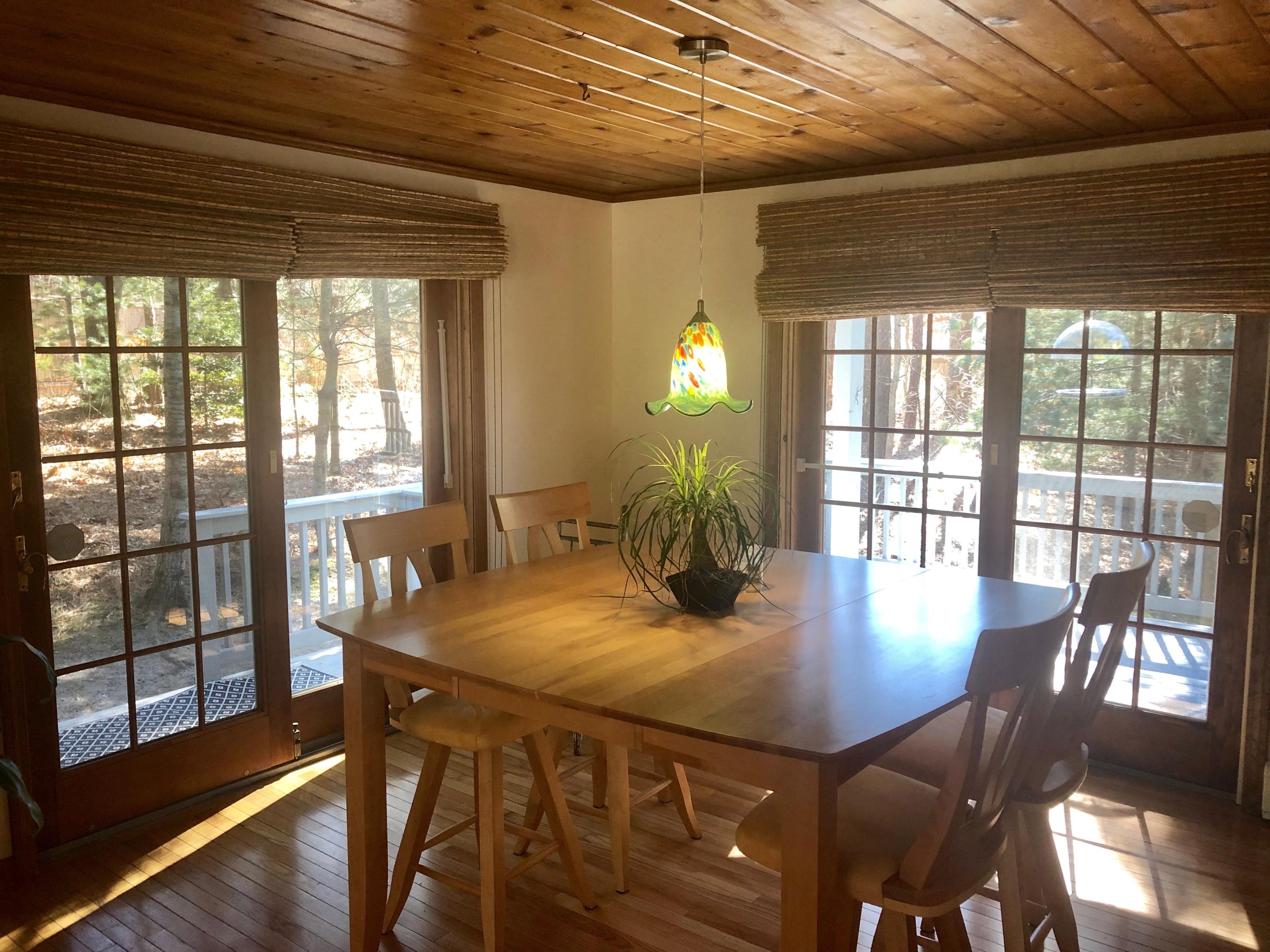 233 Oldham Road Osterville, MA 02655 - Photo 13 of 35 a view of a dining room with furniture and wooden floor