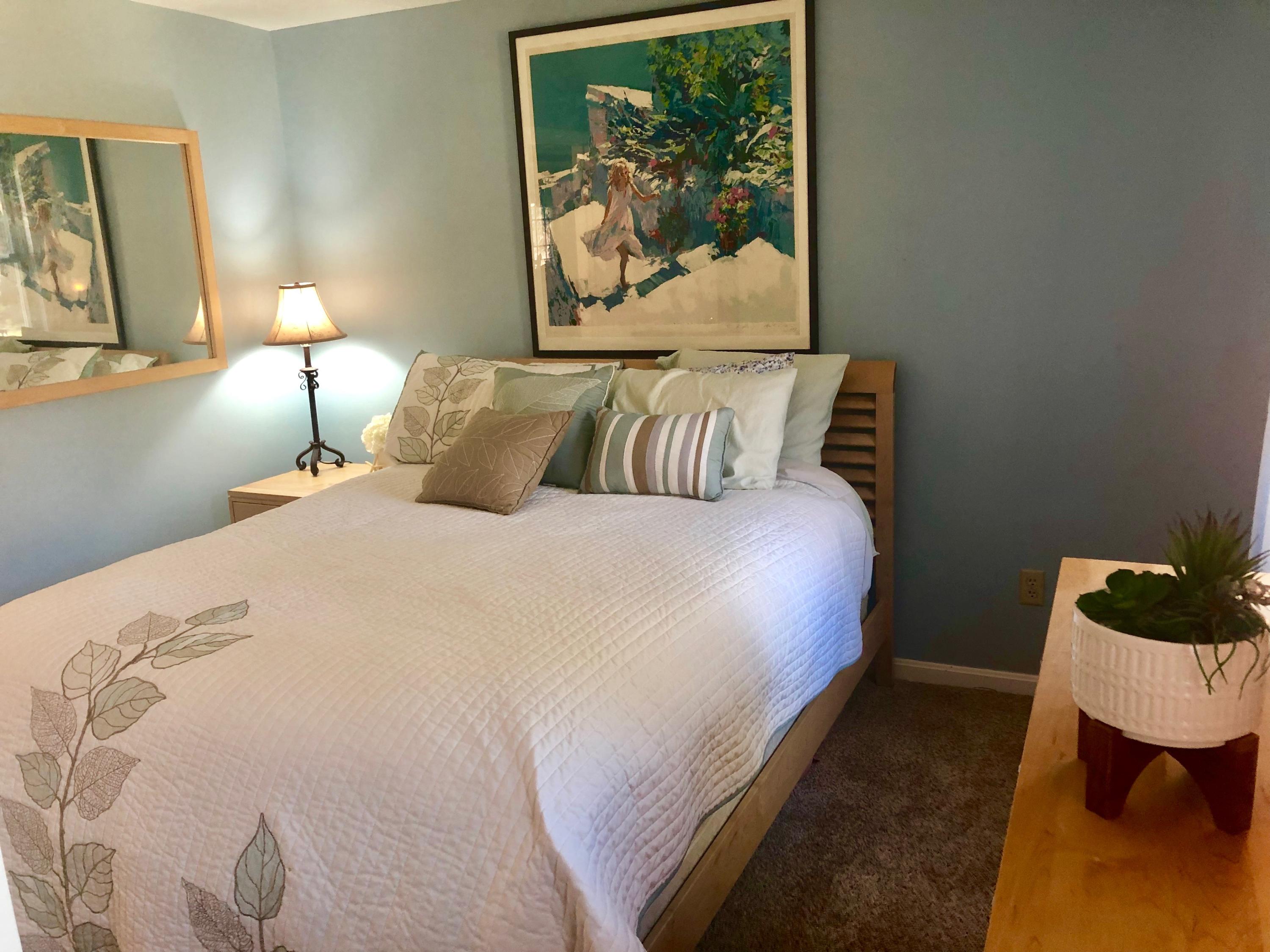 233 Oldham Road Osterville, MA 02655 - Photo 19 of 35 a large bed sitting in a bedroom next to a lamp