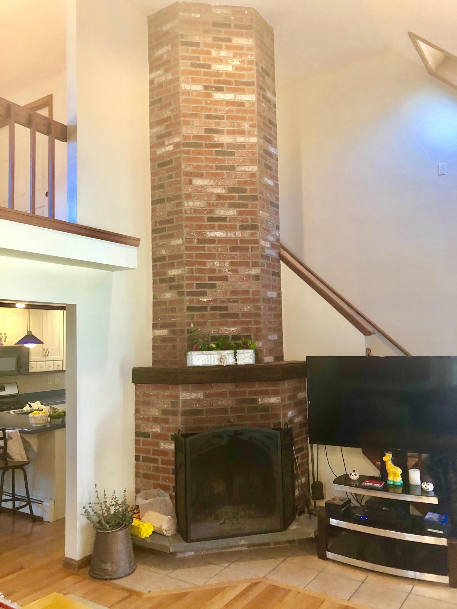 233 Oldham Road Osterville, MA 02655 - Photo 10 of 35 a living room with a fireplace