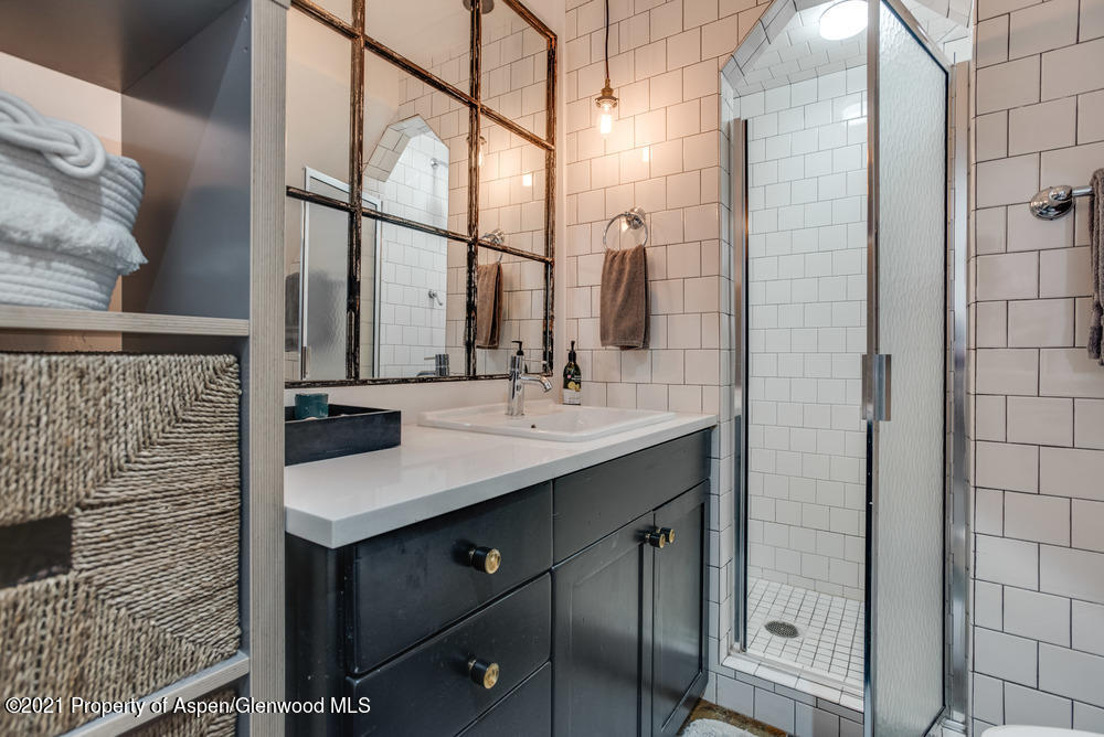 2661 Juniper Hill Road Aspen, CO 81611 - Photo 18 of 31 a bathroom with a sink and a mirror