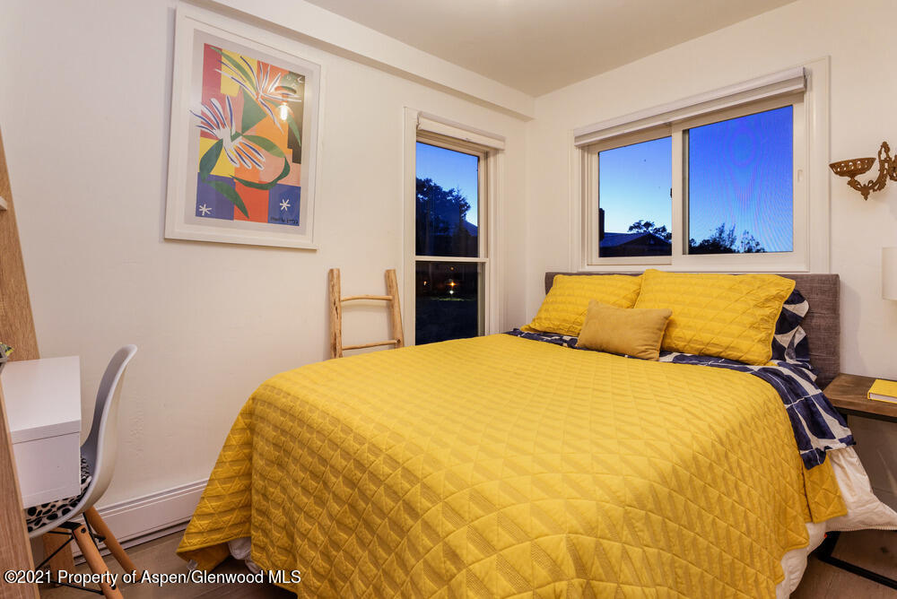 2661 Juniper Hill Road Aspen, CO 81611 - Photo 19 of 31 a bedroom with a bed and dresser