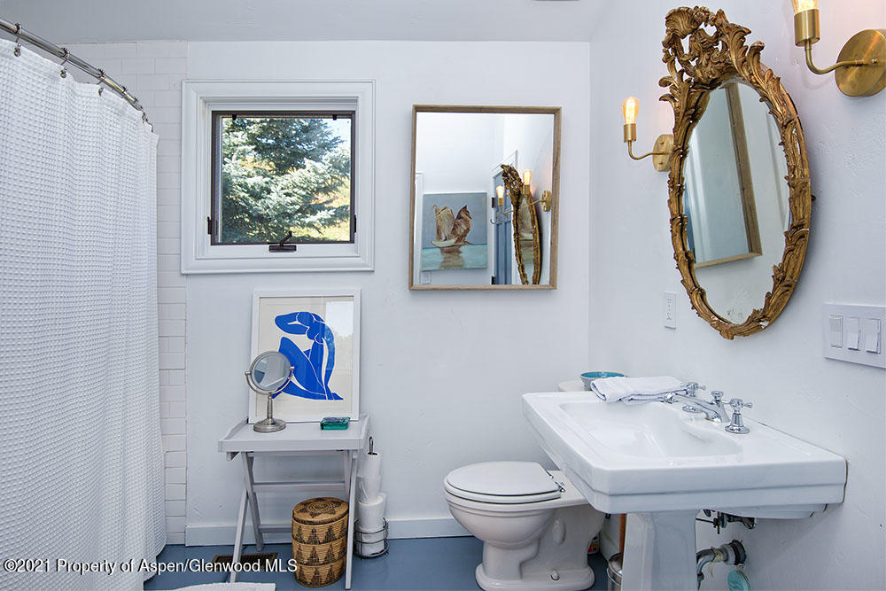 2661 Juniper Hill Road Aspen, CO 81611 - Photo 25 of 31 a bathroom with a sink mirror and toilet