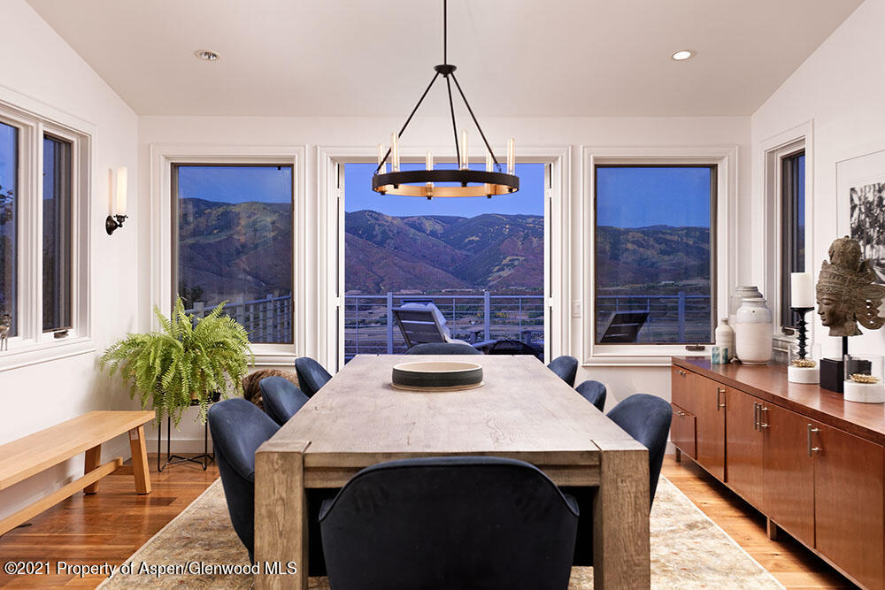 2661 Juniper Hill Road Aspen, CO 81611 - Photo 6 of 31 a view of a dining room with furniture window and wooden floor