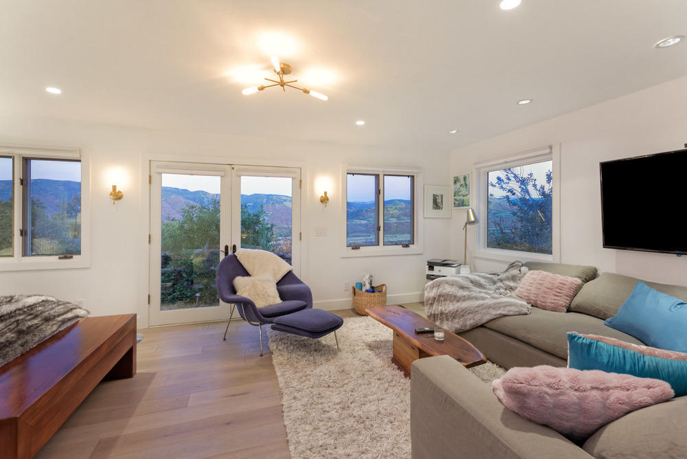 2661 Juniper Hill Road Aspen, CO 81611 - Photo 10 of 31 a living room with furniture and a flat screen tv