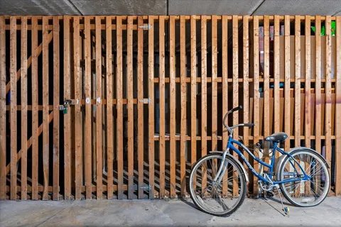 a view of a backyard with wooden fence