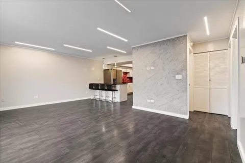 a view of work space with wooden floor and windows