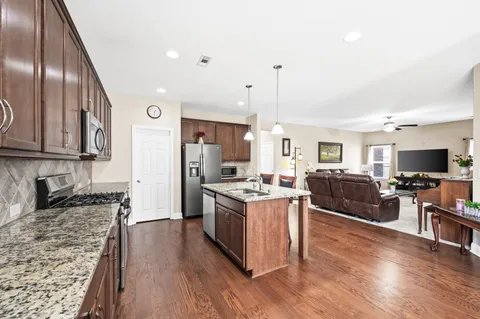 a bedroom with a bed and a potted plant
