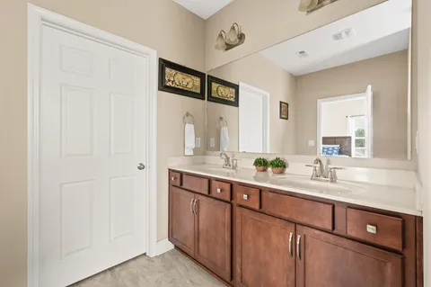 a view of a chair and table in the back yard of the house