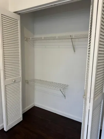 a view of an empty walk in closet